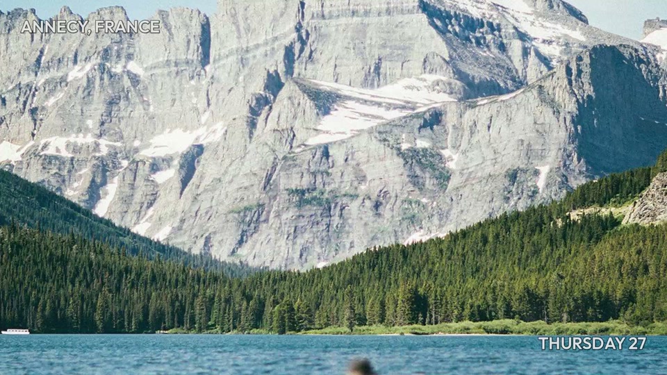 Basic at 48 seconds: a lake below a mountain and forested shore.